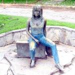 Bardot Statue sitting on suitcase in Buzios