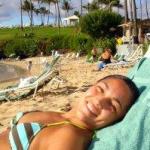 Girl tanning at DT Fleming Beach Park, Maui