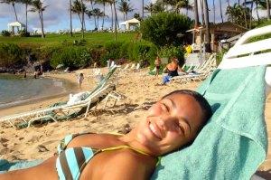 Girl tanning at DT Fleming Beach Park, Maui