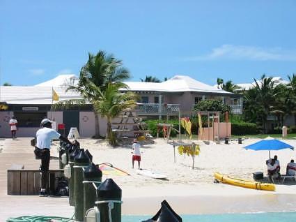 The watersports center (SCUBA, snorkel, boats etc.), with in the background Parrot Cay villas