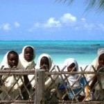 Kids peering at Jambiani Beach, Zanzibar